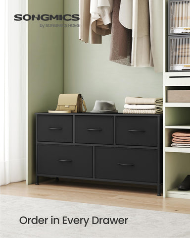 SONGMICS dresser with five drawers in ebony black stores clutter discreetly.
