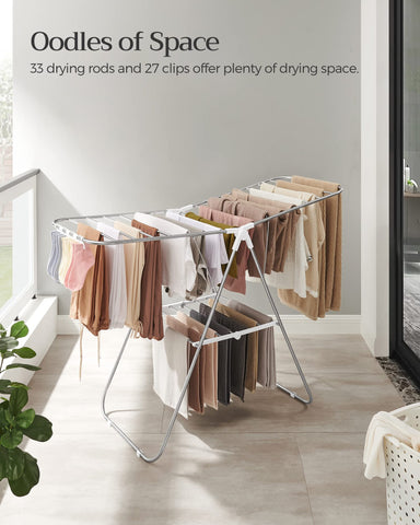 SONGMICS rack with adjustable wings for varying garment lengths