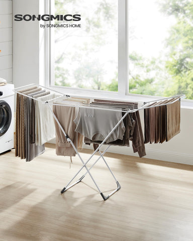SONGMICS drying rack folded-compact demonstrates easy storage and space saving.
