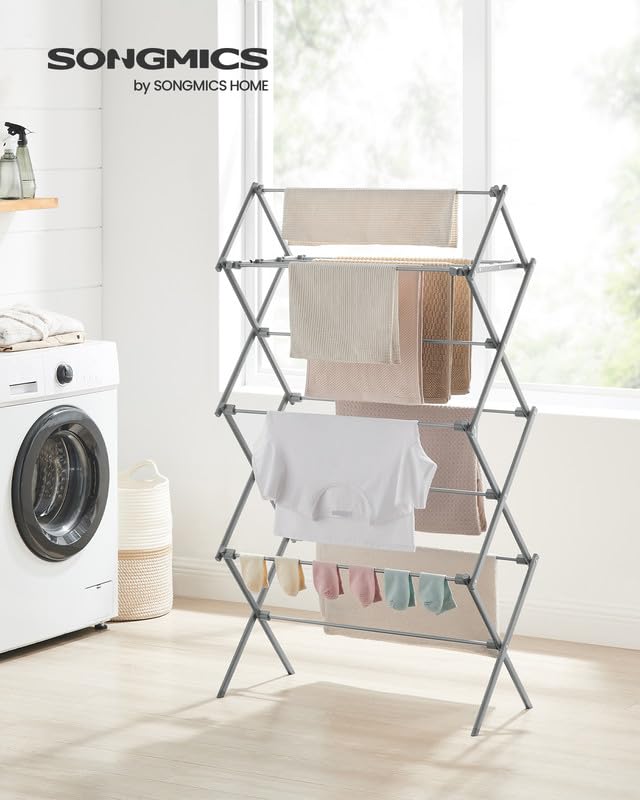 Songmics drying rack outdoors in sunlight, featuring rust-resistant steel.