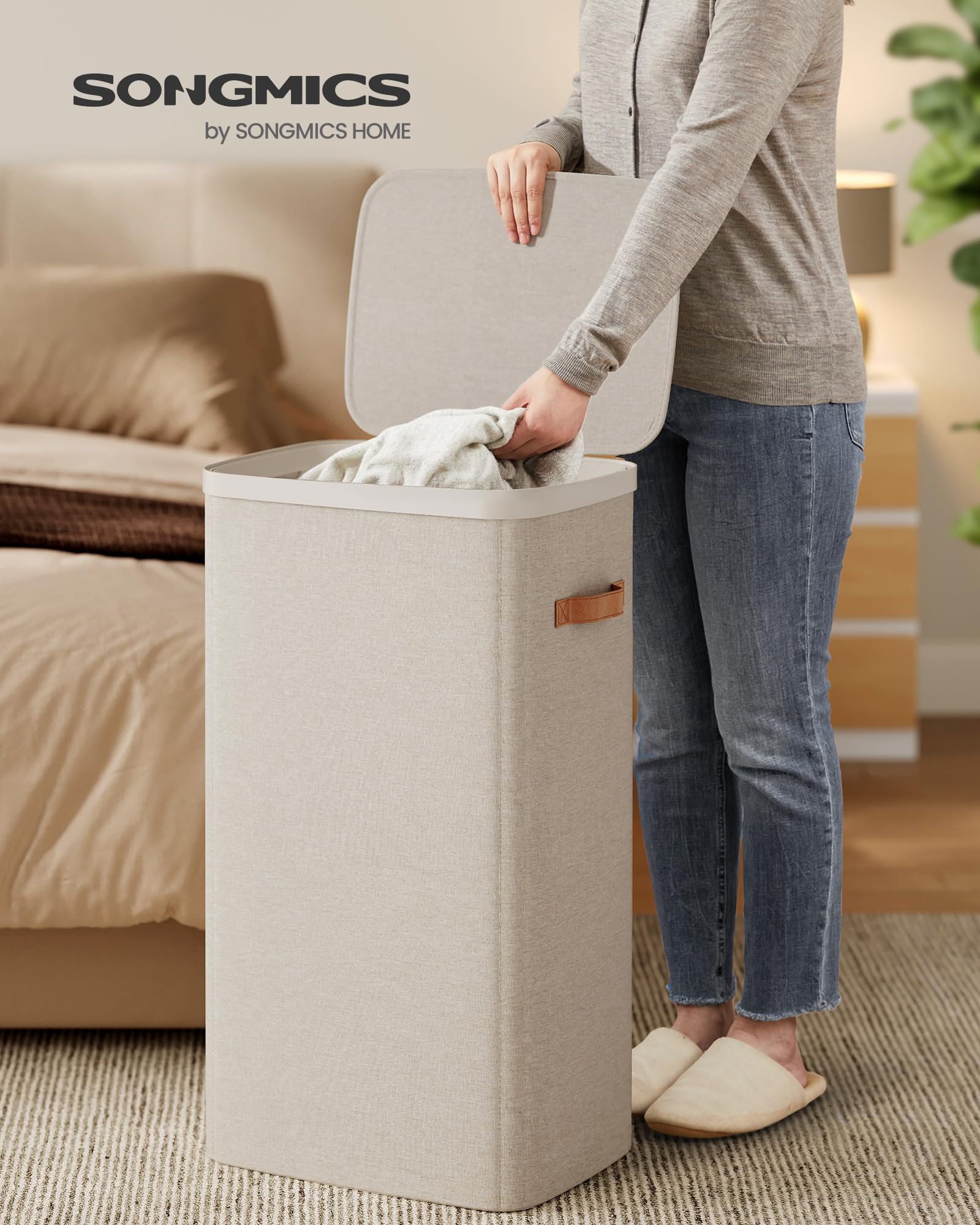 SONGMICS laundry basket with easy-assembly setup and sturdy inner liner.