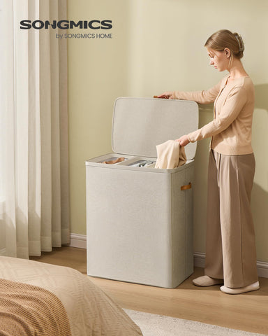 SONGMICS laundry basket with lid keeps clothes dust-free and private.
