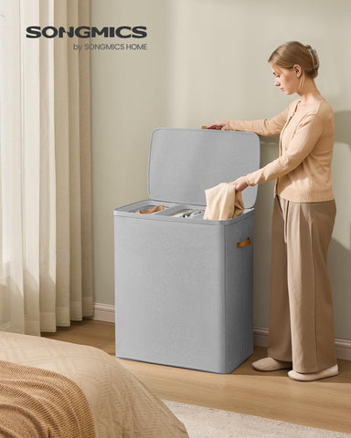Songmics lidded laundry basket keeps clothes dust-free and private.