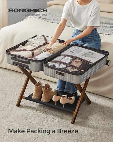 SONGMICS luggage rack side view shows sturdy bamboo frame and durable straps.