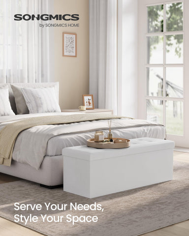 Songmics Mazie ottoman base opened shows 131 L storage for linens and clothes.