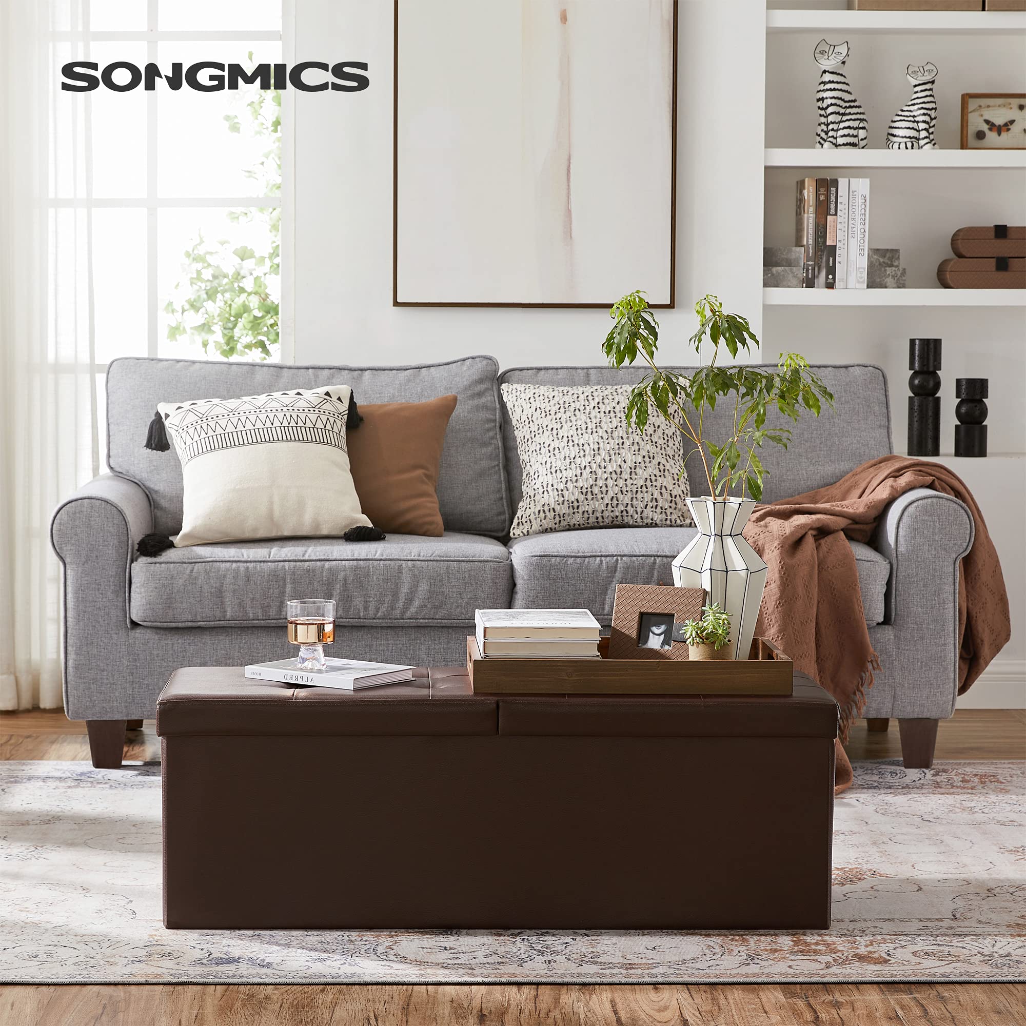SONGMICS MAZIE ottoman offers ample 120 L storage for blankets and books.