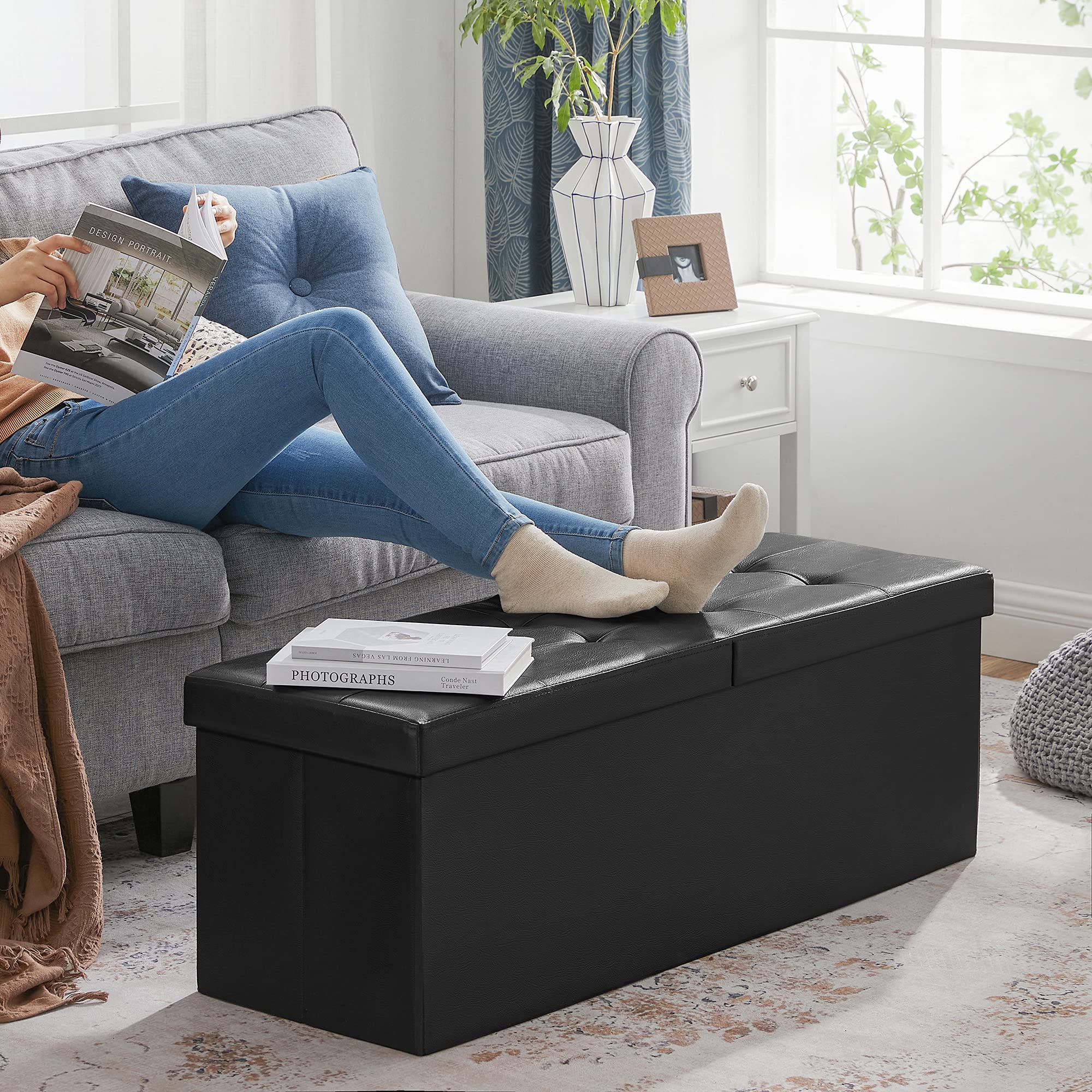SONGMICS Mazie ottoman lid reinforced with metal guards for durability.