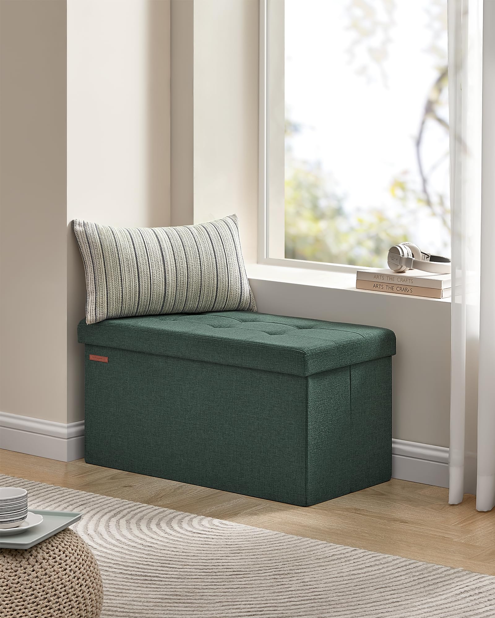 SONGMICS Mazie retro green ottoman in a modern living room