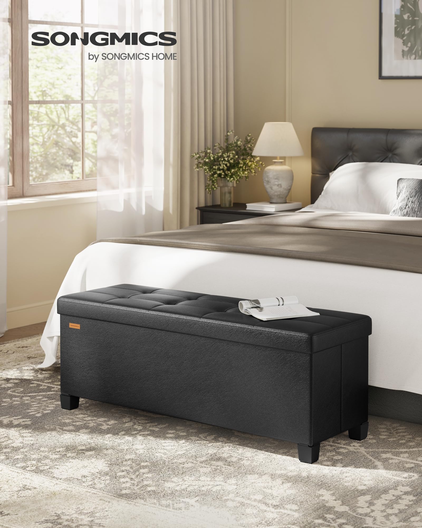 SongMICS ink black ottoman with lid open showing 112 L storage capacity.