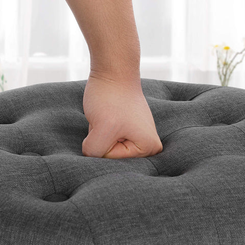 SONGMICS round ottoman used as an extra seat during guests
