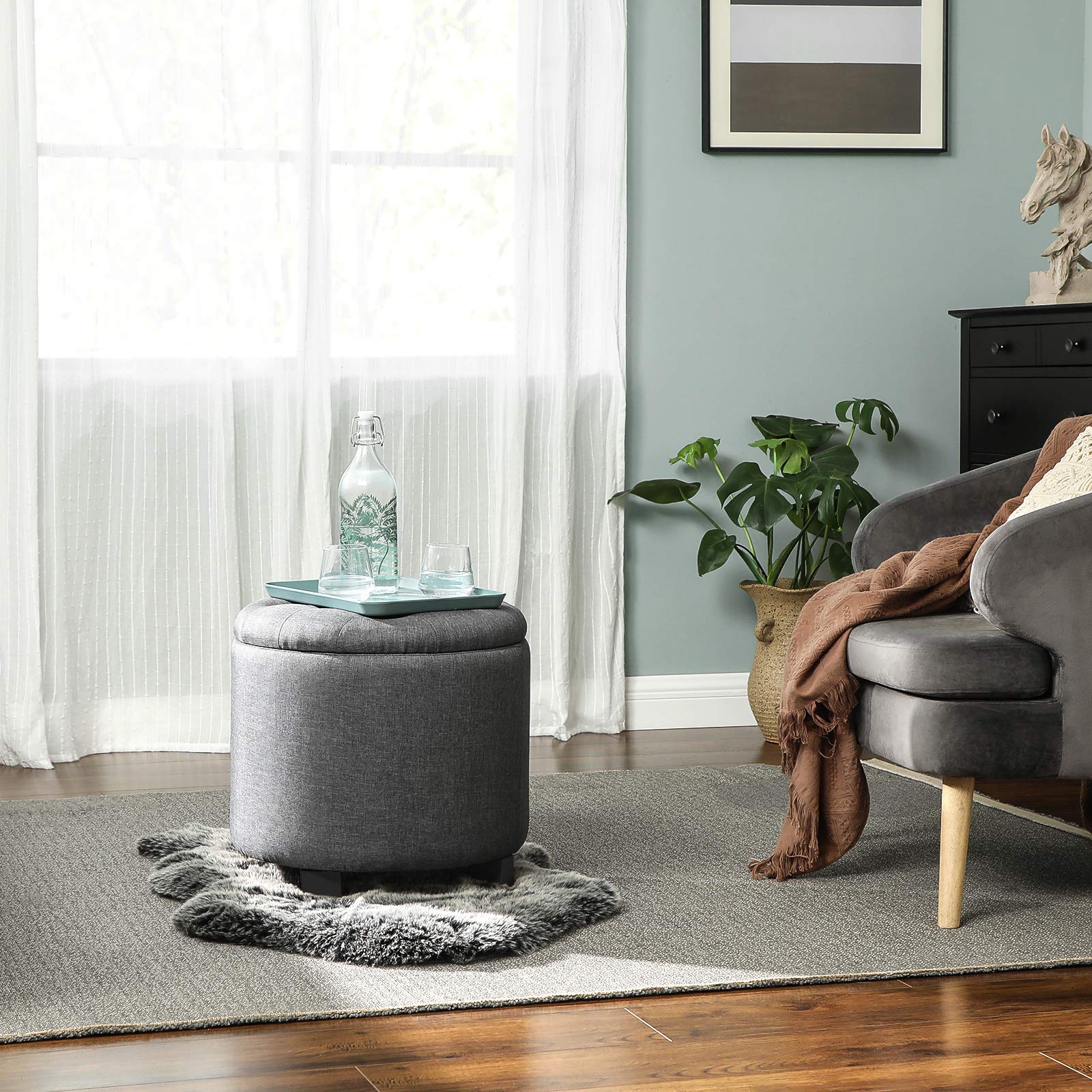 SONGMICS round ottoman with hidden storage lid closed, tidy surface