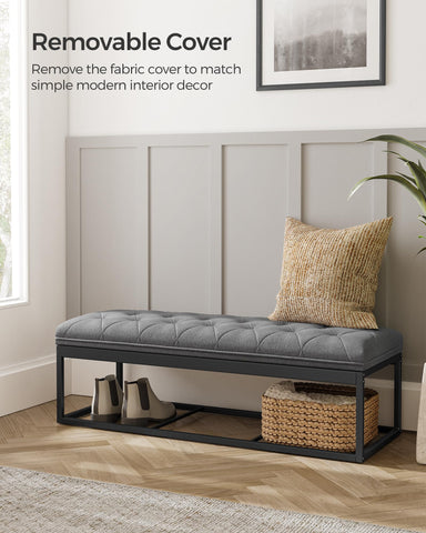 Songmics blanket and book storage inside a spacious ottoman.