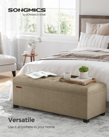 Songmics camel brown ottoman bench with cover off blends into modern decor and open storage.