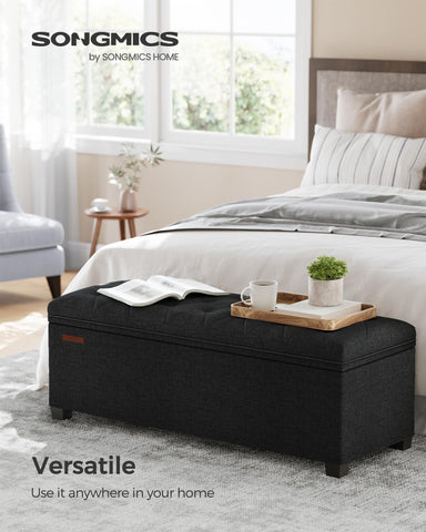 Songmics ottoman bench shows spacious 27-gallon storage for blankets and books.