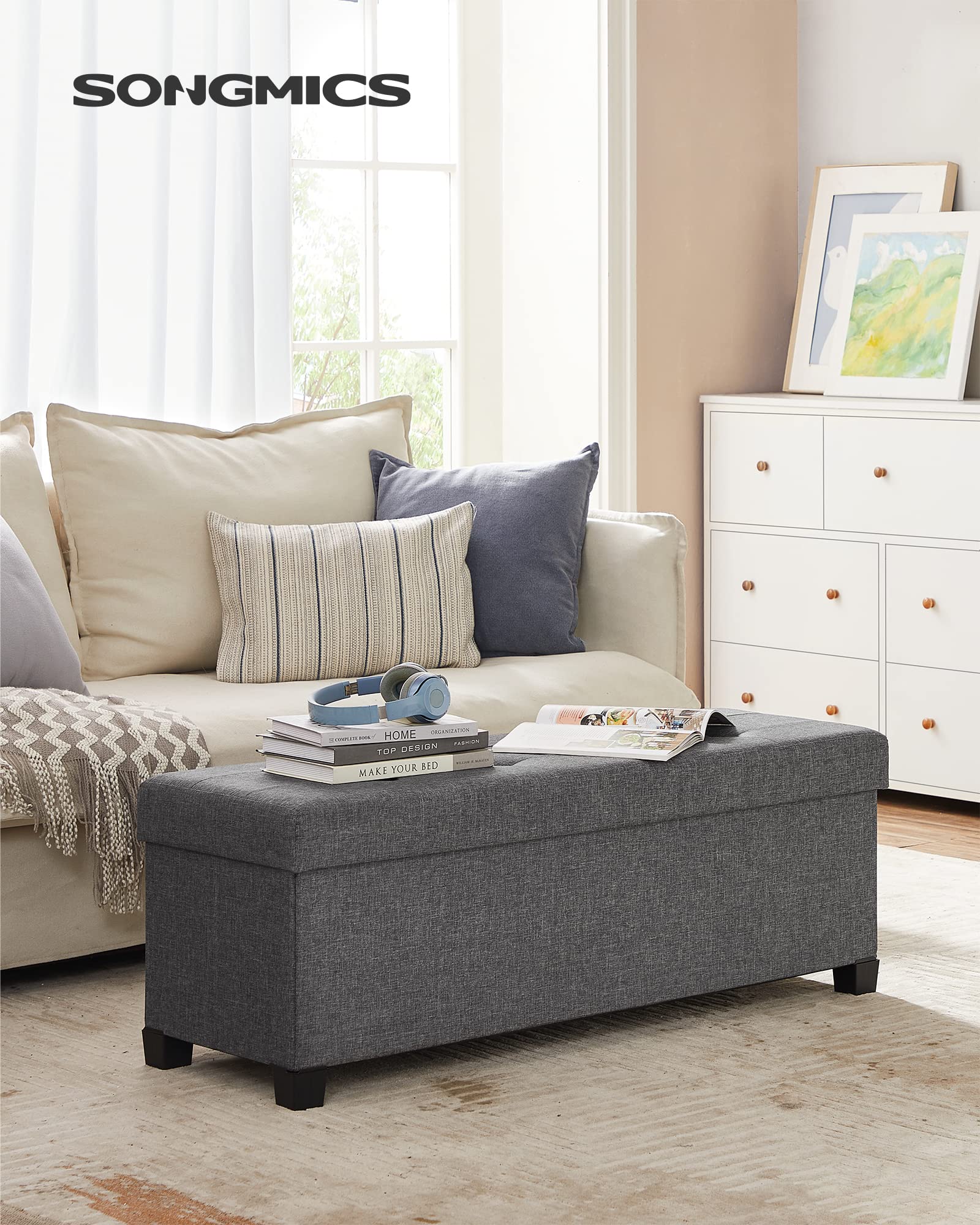 SONGMICS storage ottoman bench padded top offering comfortable seating and support.