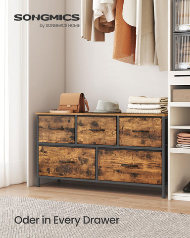 Songmics storage tower with non-woven fabric drawers keeps spaces tidy.