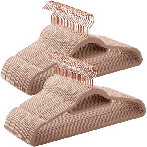 Songmics velvet hangers with rose-gold swivel hooks keep outfits organized and secure.