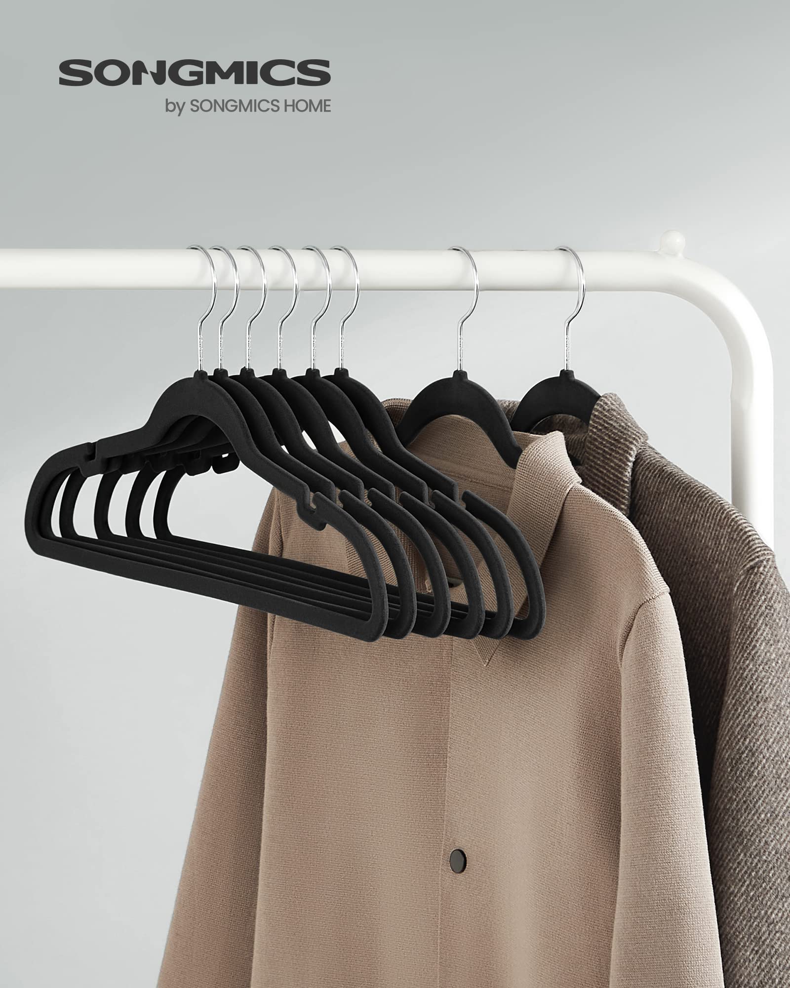 SONGMICS velvet hangers with shoulder notches securing delicate straps without slipping.
