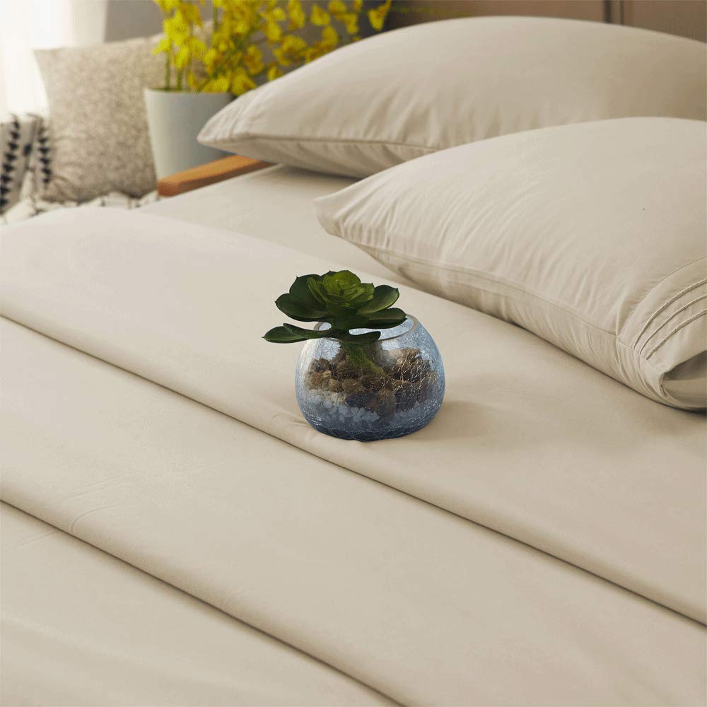SONORO KATE beige queen sheet draped on a bed for a magazine look
