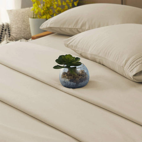 SONORO KATE beige queen sheet draped on a bed for a magazine look