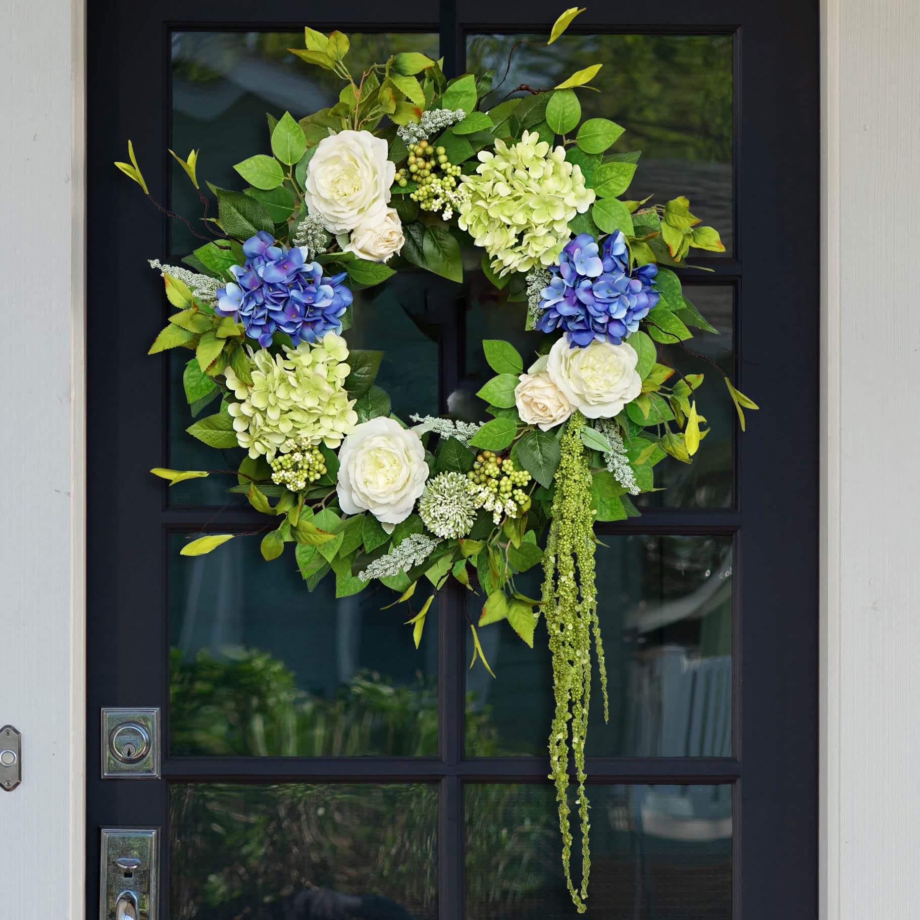 Soomeir hydrangea wreath on front door adds vibrant curb appeal.