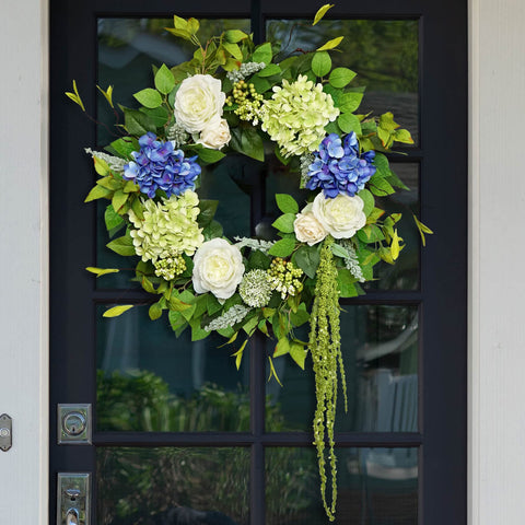 Soomeir hydrangea wreath on front door adds vibrant curb appeal.