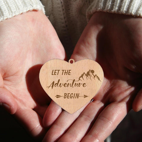 Soruney Let the Adventure Begin two-sided display with a heart motif on both sides.
