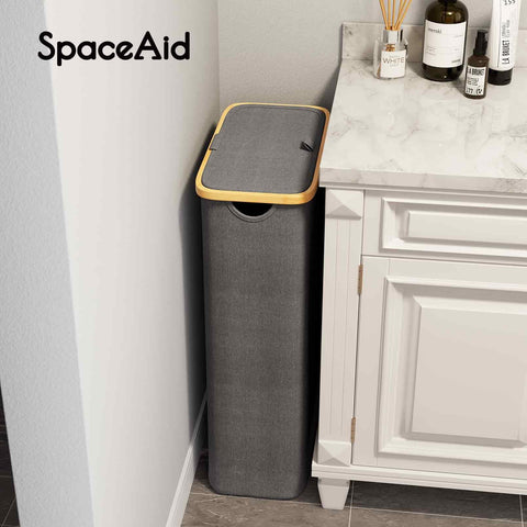 SpaceAid Slim Laundry Hamper carried by the bamboo handle for easy transport