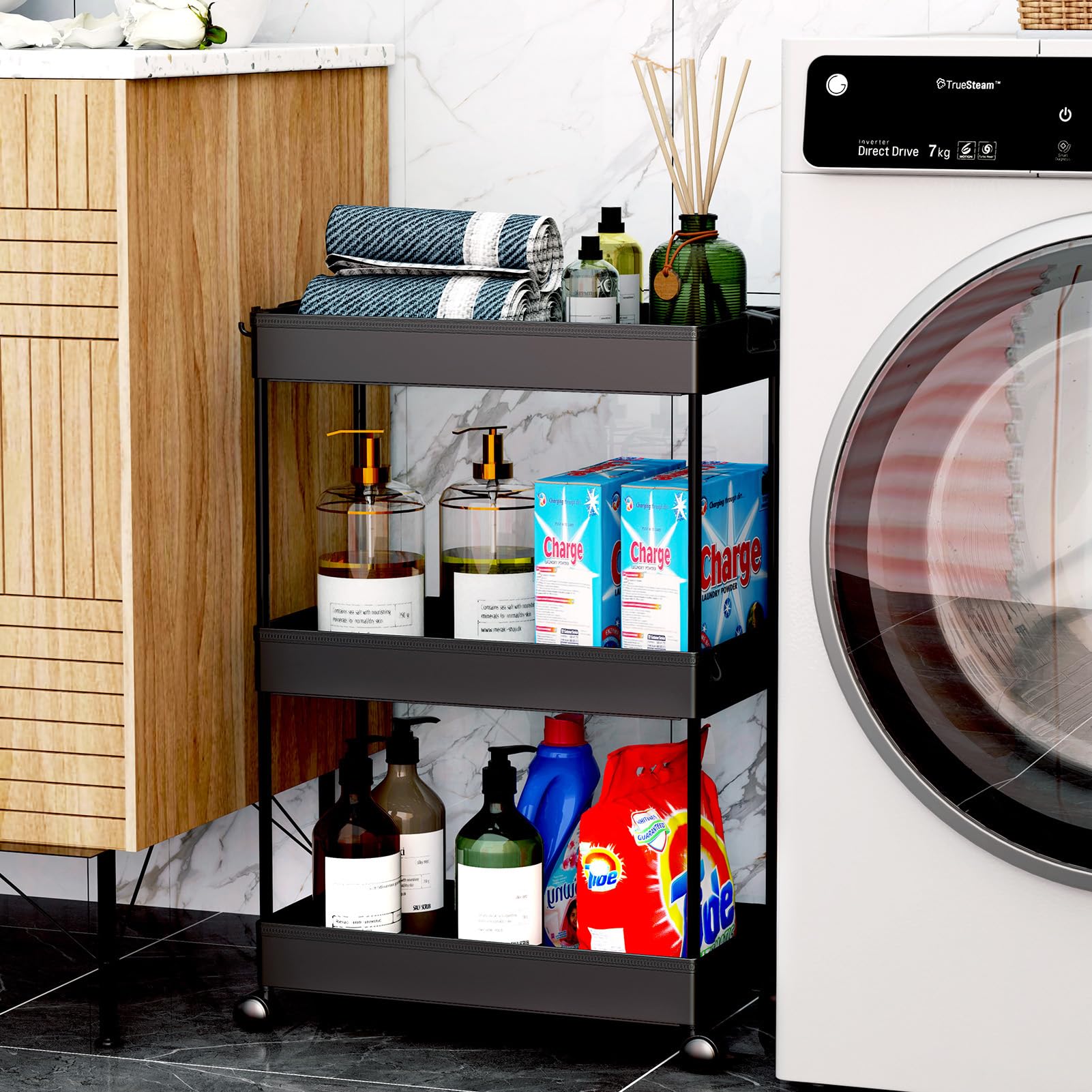 SPACEKEEPER rolling storage cart in laundry area with side hoops for extra storage.