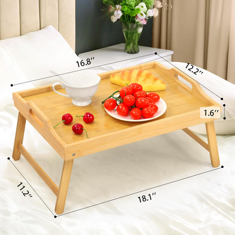 SPOPSOOD bed tray doubles as a compact laptop desk on the sofa.