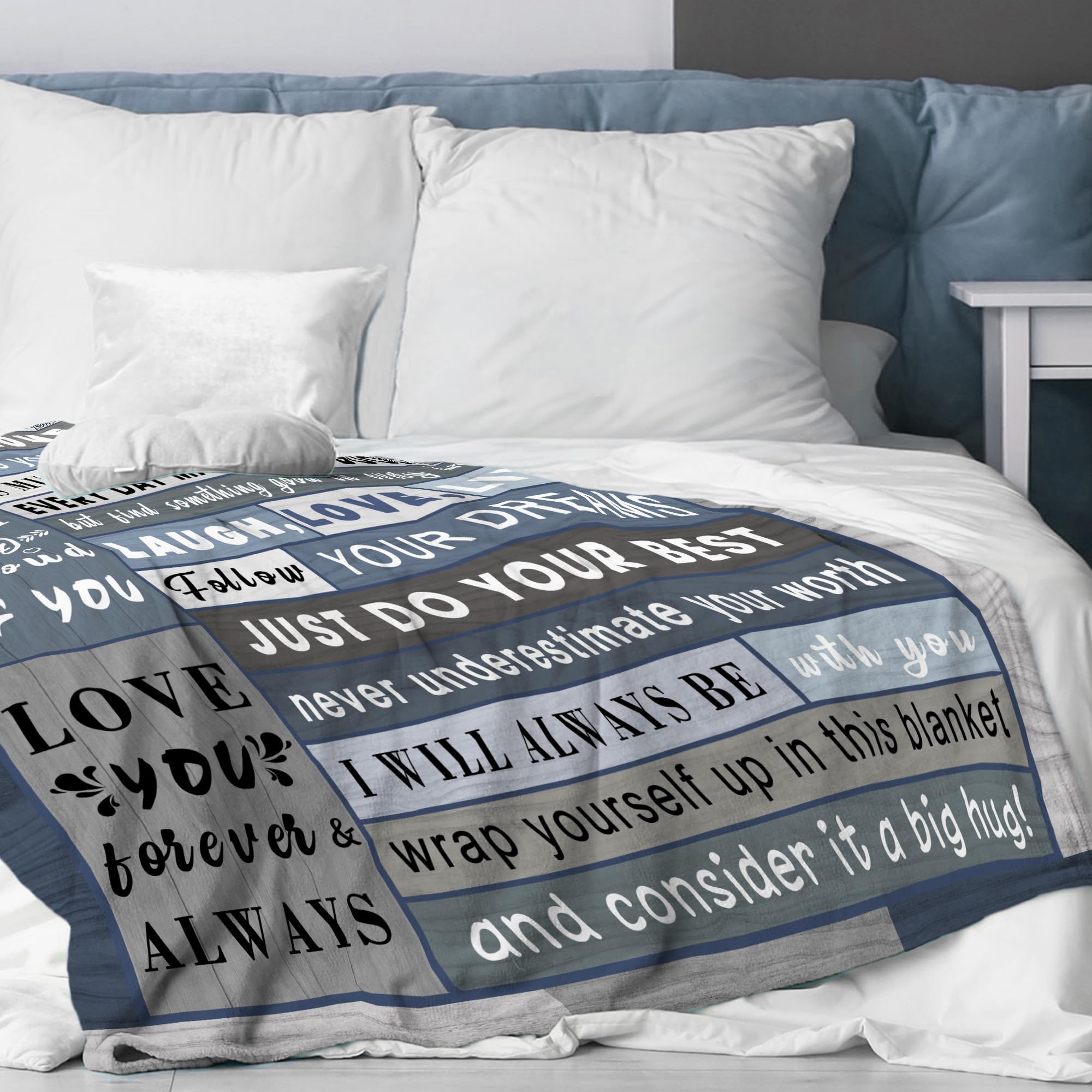 Spwasplo blanket draped on bed for cozy evenings.