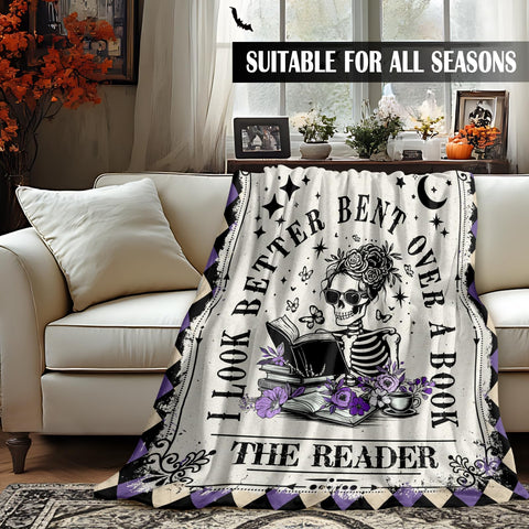 Sruemiul cozy reading nook with blanket creates a warm retreat.