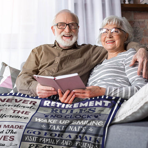 Sruemiul funny retirement gift blanket on display during celebration, adds lighthearted charm.