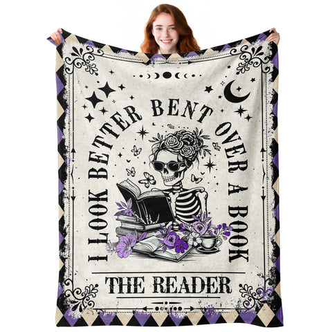Sruemiul skeleton reading blanket closeup shows gothic design for cozy nights.