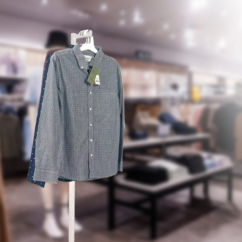 SSWBasics single-arm costumer stand provides focused hanging space for curated outfits.