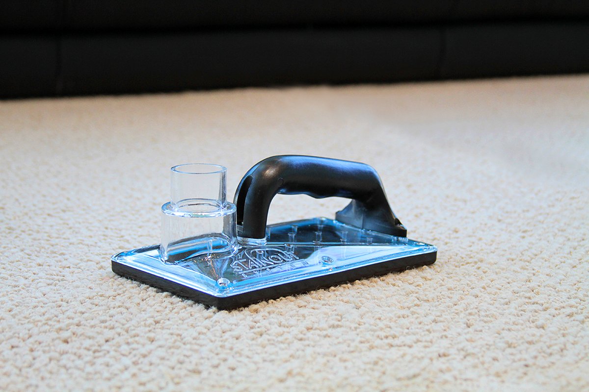 StainOut System 71-001 in action beneath carpet targeting odor sources.