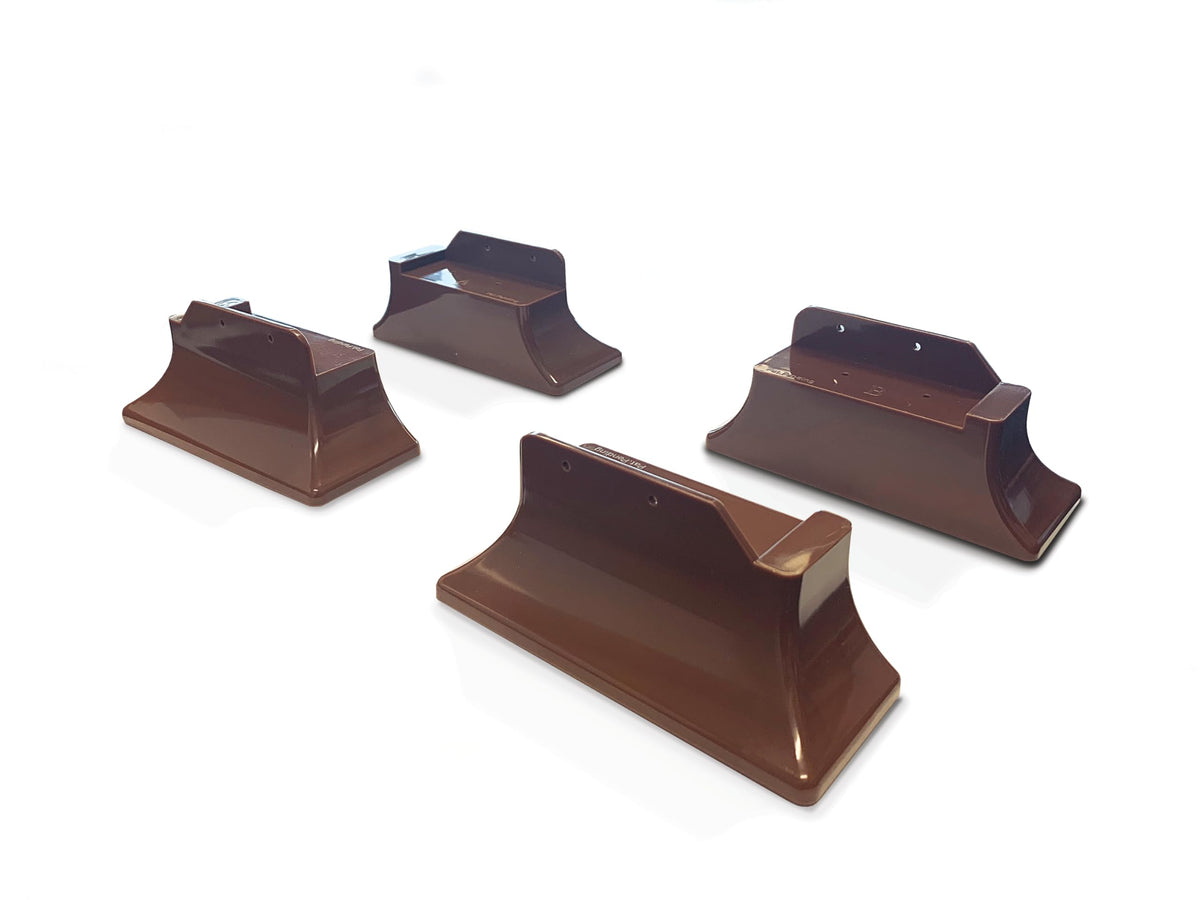 Stander Recliner Risers on wooden legs provide stable height boost for easier standing.