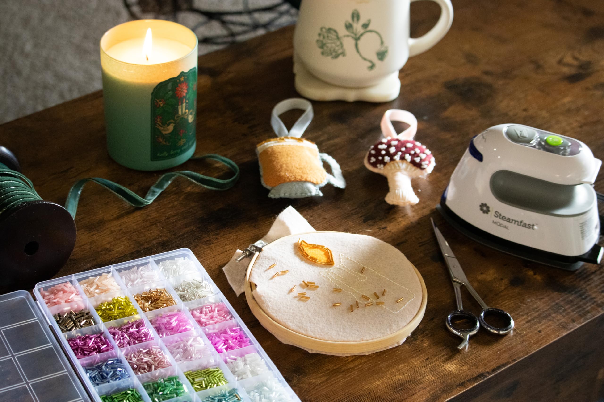 Steamfast Modal Dual-Voltage Iron during use on craft fabric with steam control engaged.