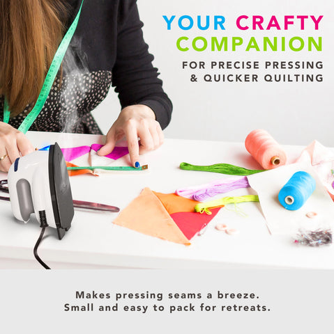 Steamfast Modal Dual-Voltage Iron in a travel bag highlighting portable design.