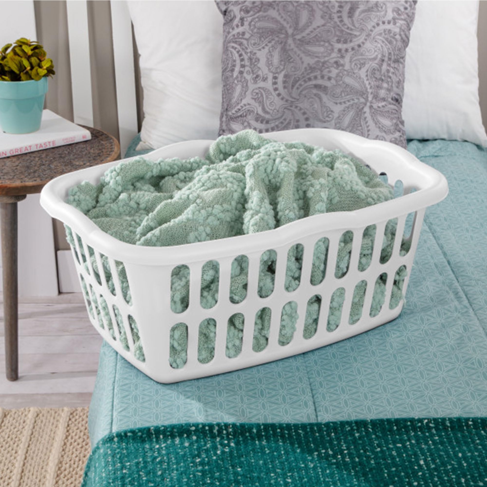 Sterilite laundry basket contoured grip handles enhance one-handed carrying.