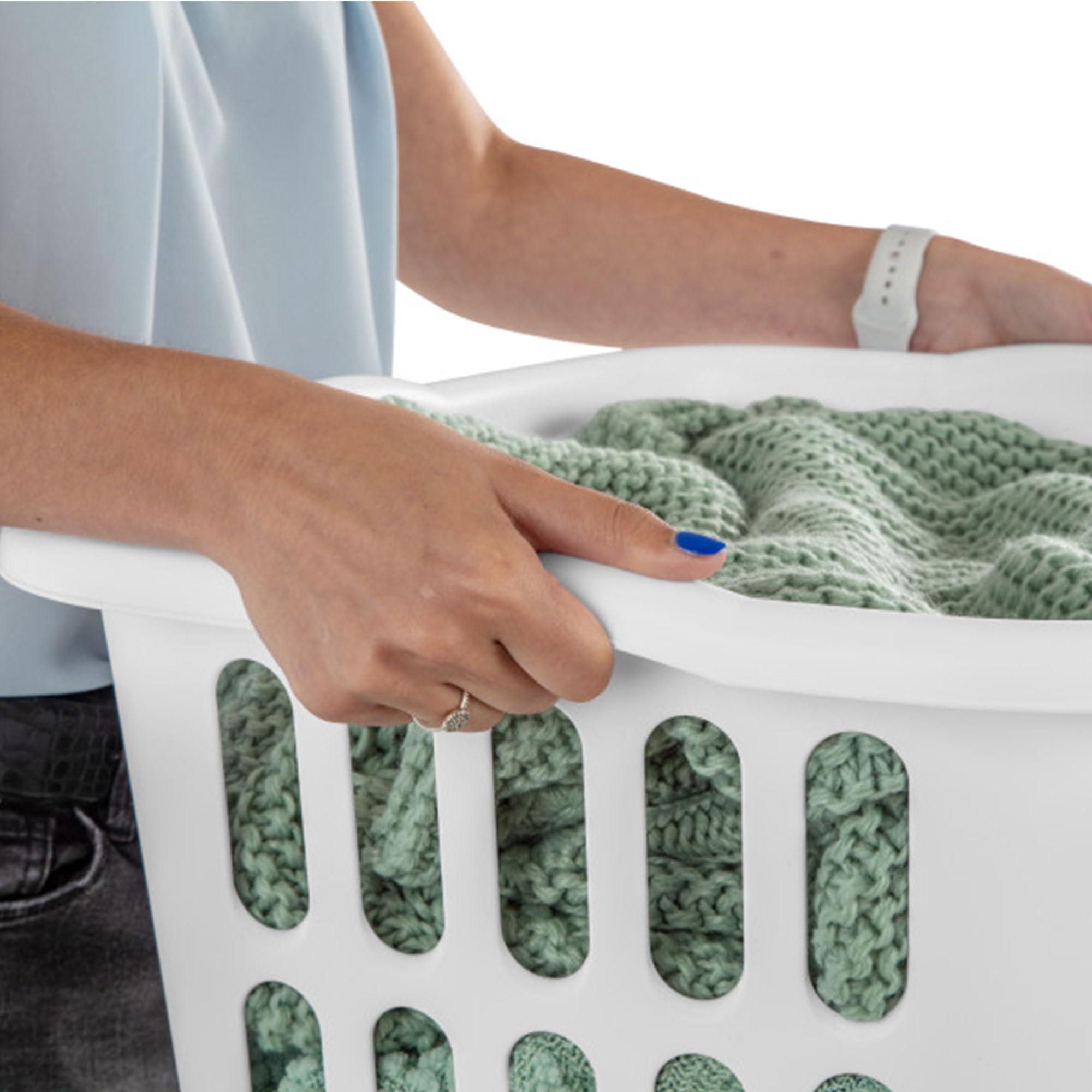 Sterilite white basket in a bathroom to sort towels.