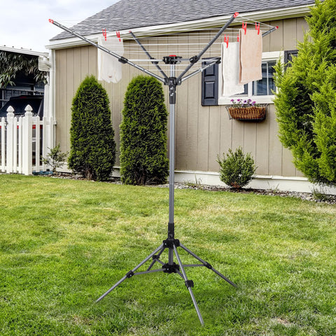 STO STO umbrella clothesline 82ft-drying-space-extended demonstrates ample outdoor drying capacity in compact areas.