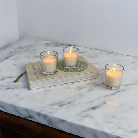 Stonebriar centerpieces glow with these votives for warm tablescapes.