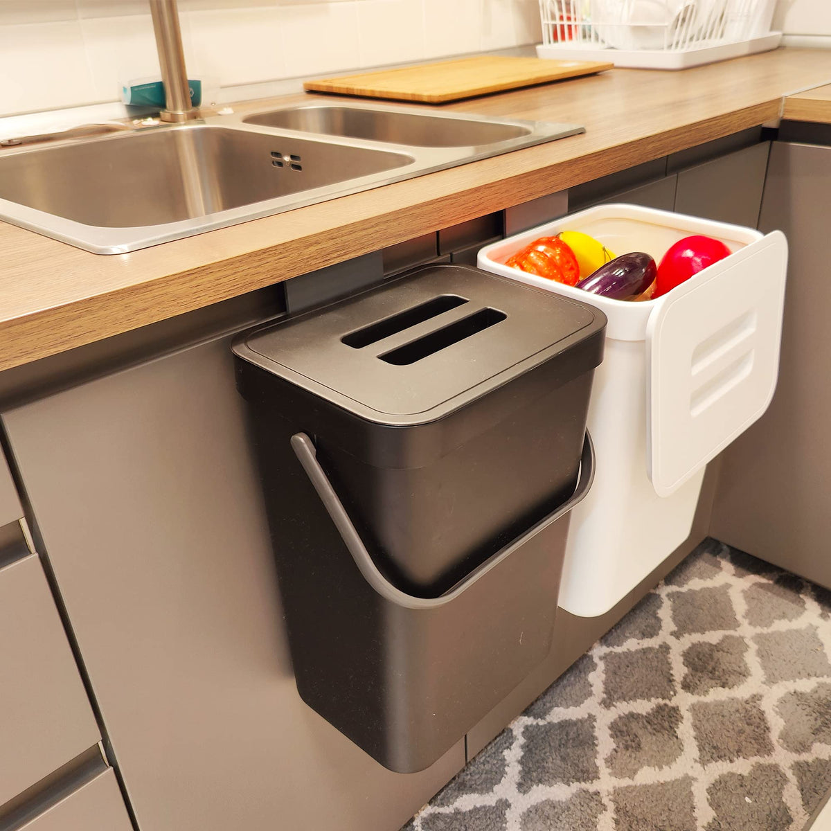 stonespace under-sink trash can hanging on cupboard door to save counter space