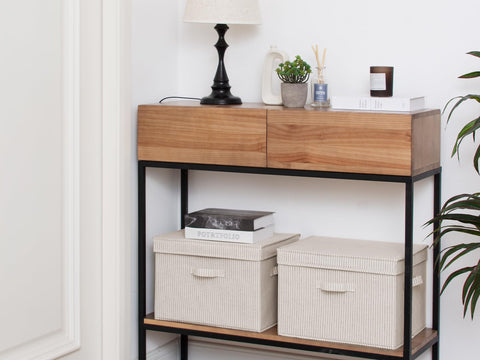 StorageWorks collapsible bin folded flat for compact storage.