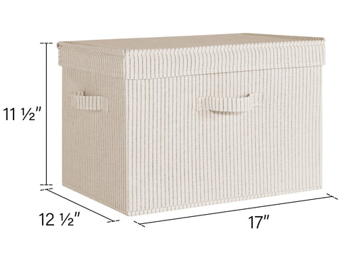 StorageWorks jumbo bin with beige stripes, lid closed beside folded towels.