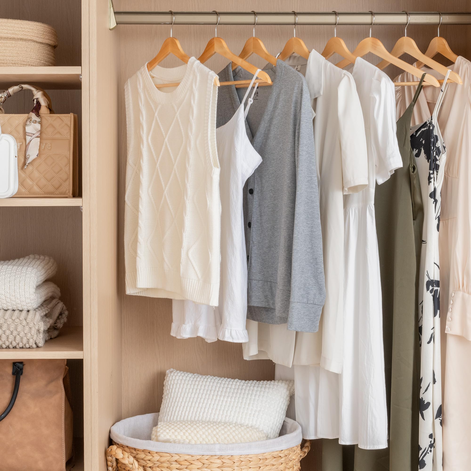 StorageWorks organized closet using wooden hangers to maximize space.