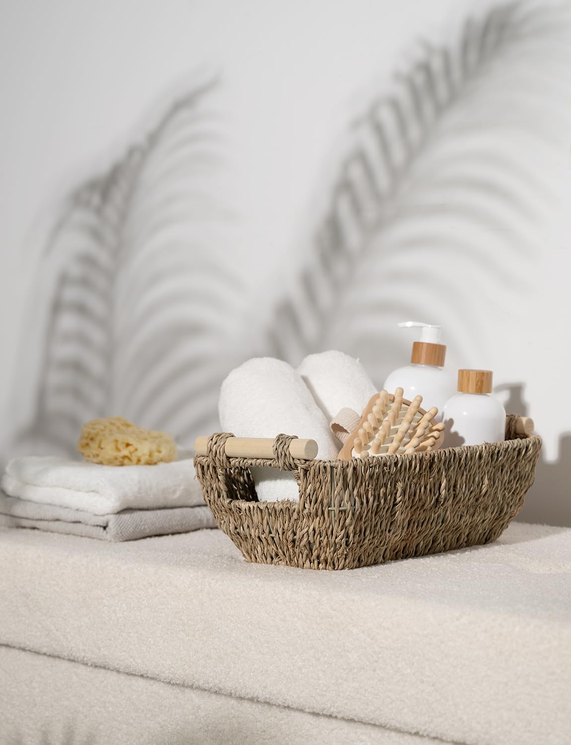 StorageWorks seagrass basket holding toilet paper on a shelf.
