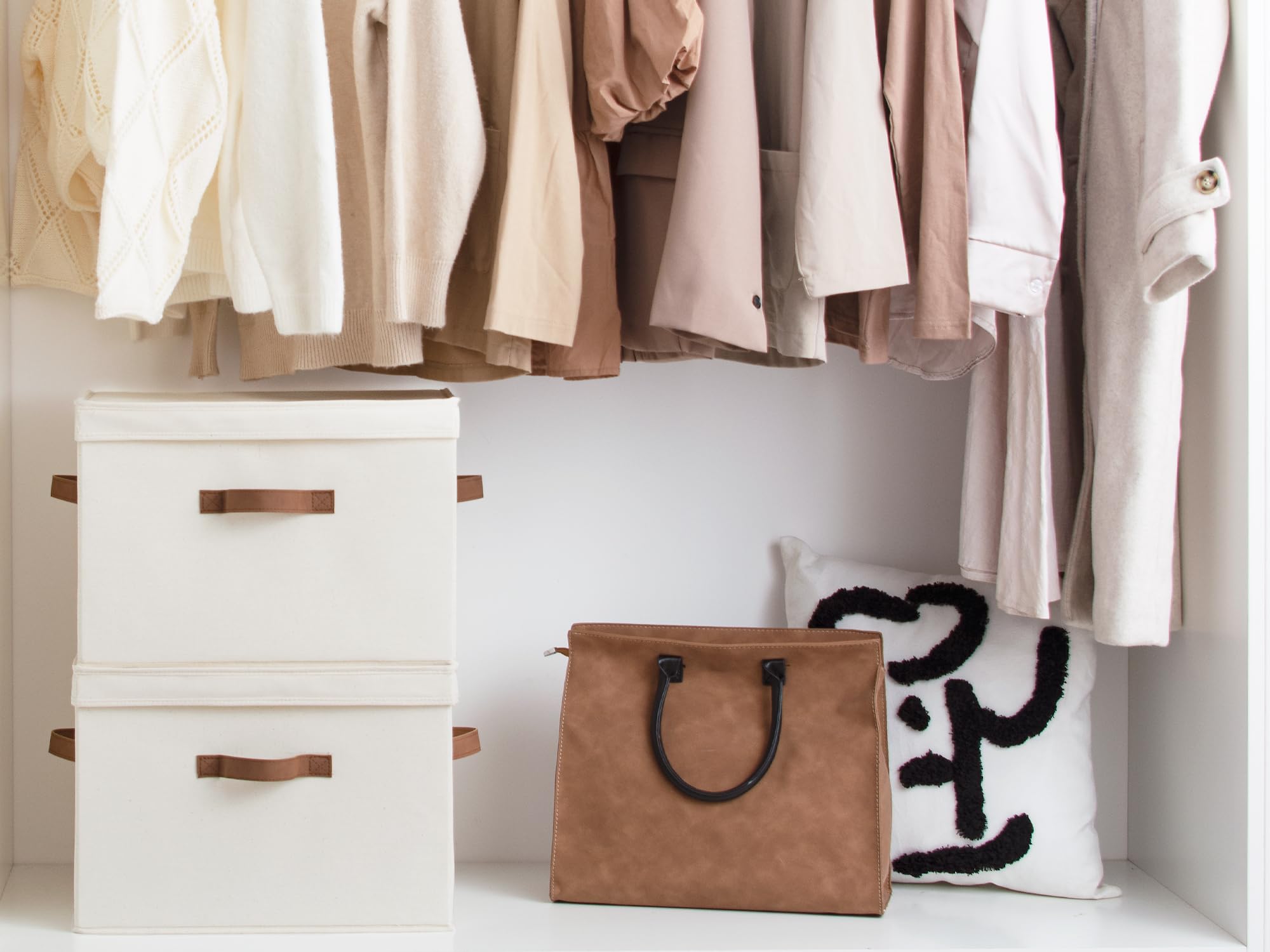 StorageWorks stackable 20L ivory bin on a closet shelf.
