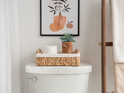 StorageWorks handwoven toilet basket with wooden handles.